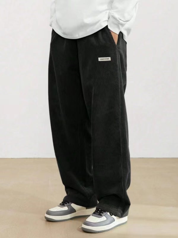 Relaxed fit men's wide leg pants. Elastic waistband for comfort & style. Versatile, with side pockets.