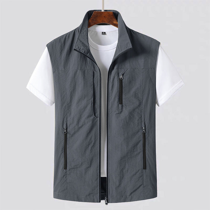 Lightweight men's utility vest with zip front. Ideal casual gilet for layering, travel & outdoor activities.