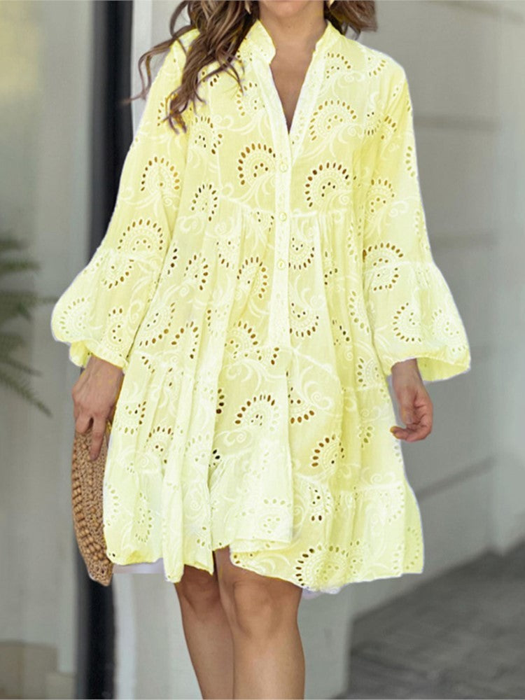Elegant bell sleeves on a women's embroidered tiered V-neck mini dress, offering a stylish silhouette.