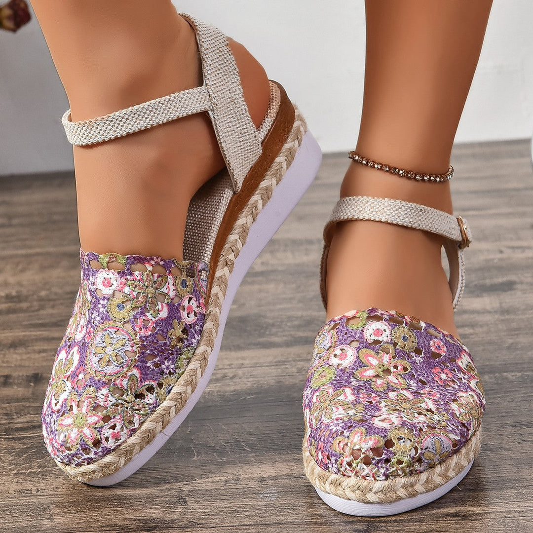 Stylish light brown espadrille flats for women, featuring a comfortable ankle strap for warm weather.