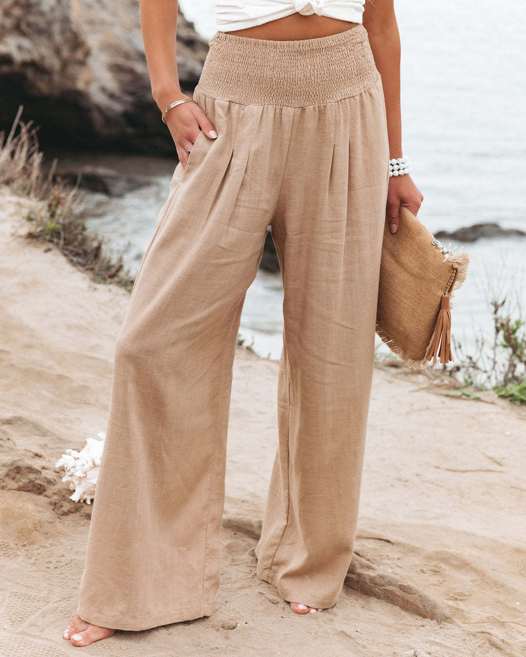 Women's high-waist wide leg pants, comfy elastic waist, relaxed fit for versatile casual wear.