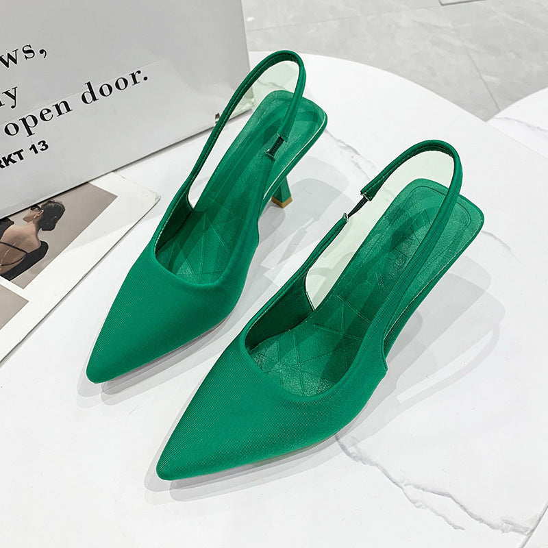 Black slingback pumps for women, showcasing a sleek pointed toe and comfortable low heel.