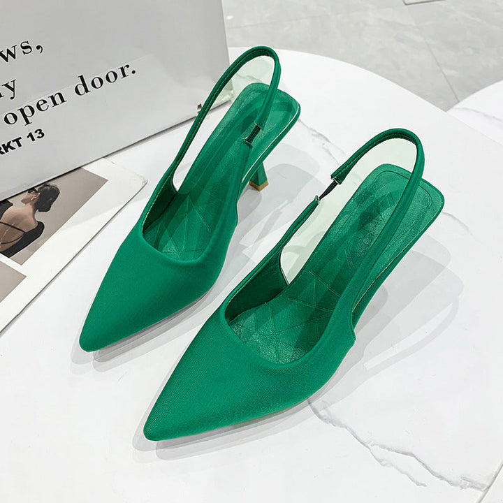 Black slingback pumps for women, showcasing a sleek pointed toe and comfortable low heel.