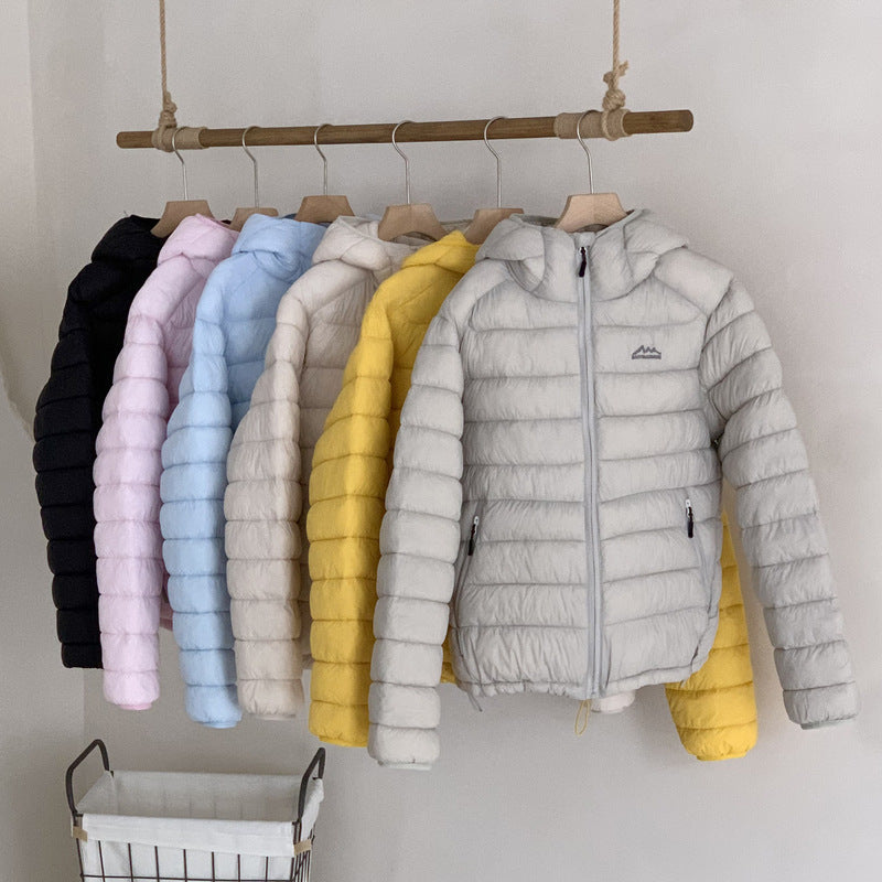 Lightweight & warm women's packable puffer coat, with a handy removable hood for adaptability.