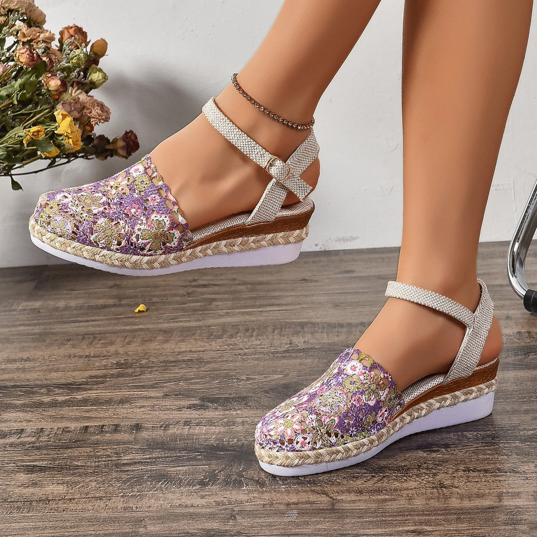 Comfortable light brown flat espadrille sandals with ankle strap, ideal for warm weather.