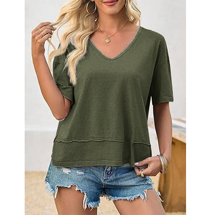 Woman wearing a stylish loose V-neck t-shirt, perfect for comfortable everyday casual spring and summer outfits.