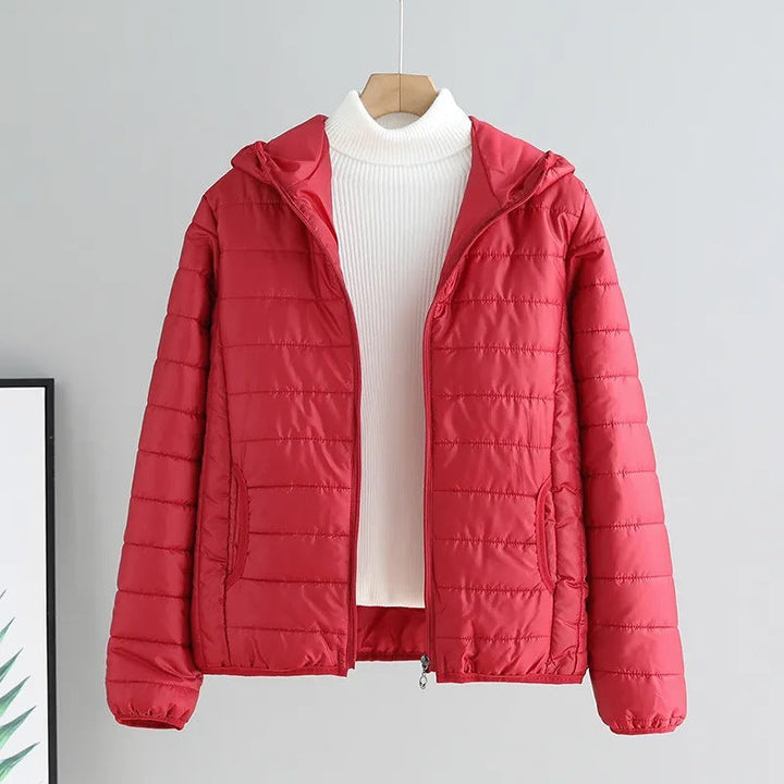 Comfortable women's hooded quilted jacket in various colors, ideal for travel & daily outings.