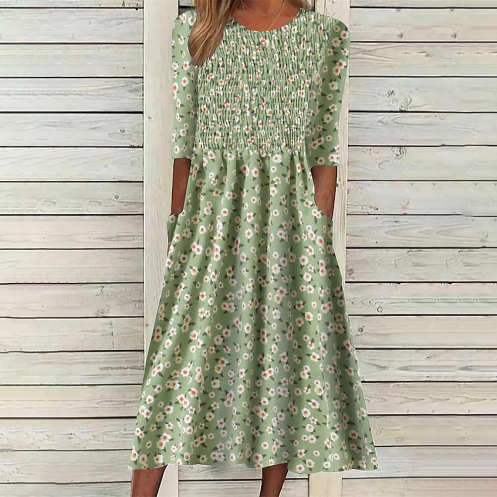Casual chic women's floral smocked midi dress, versatile for daily wear. A stylish spring fashion essential.