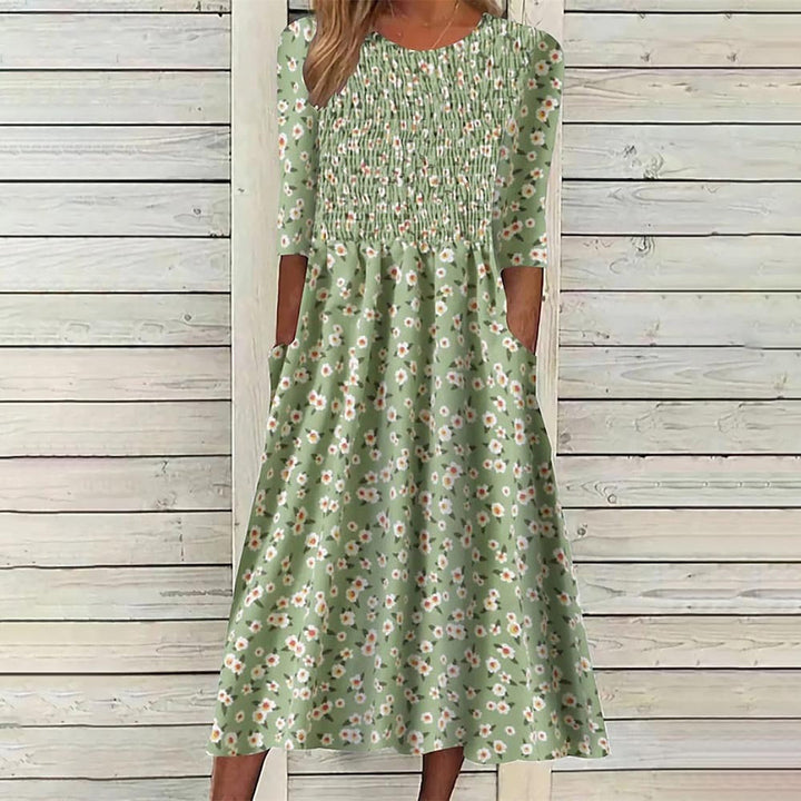 Casual chic women's floral smocked midi dress, versatile for daily wear. A stylish spring fashion essential.