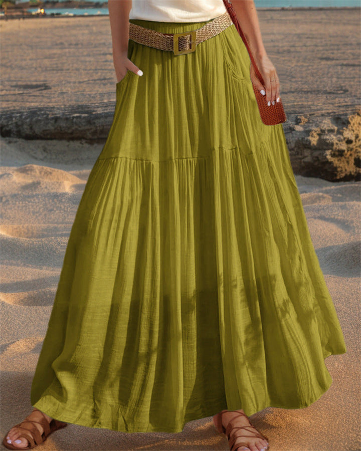 Women's summer maxi skirt, elegantly pleated and designed with convenient pockets.