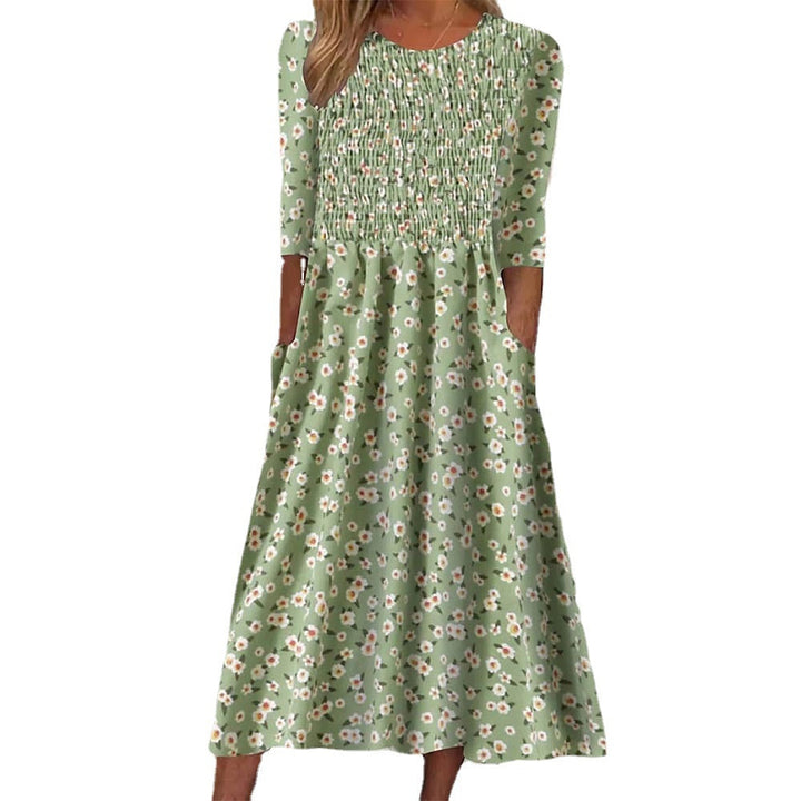 Stylish women's floral smocked midi dress for elegant wear or casual outings. Versatile spring/summer fashion.