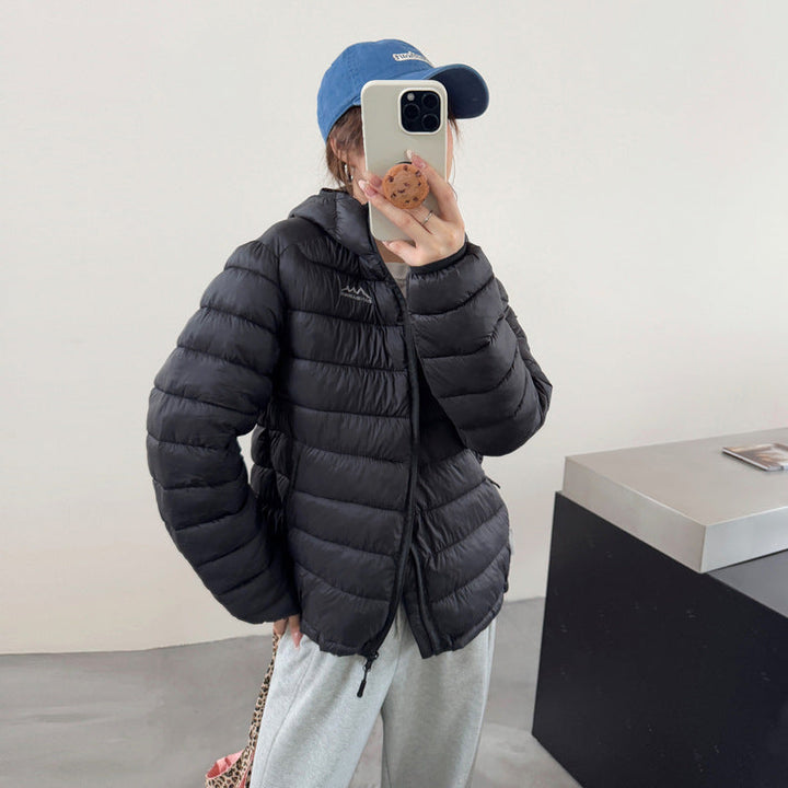 Warm women's quilted puffer jacket for winter, featuring a practical removable hood.