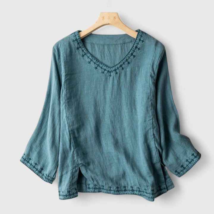 Elegant women's V-neck blouse with delicate embroidery, perfect for a stylish & versatile look.