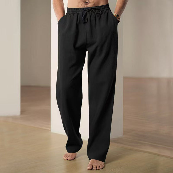 Modern men's casual pants, relaxed fit, elastic waist, combining style with supreme comfort.