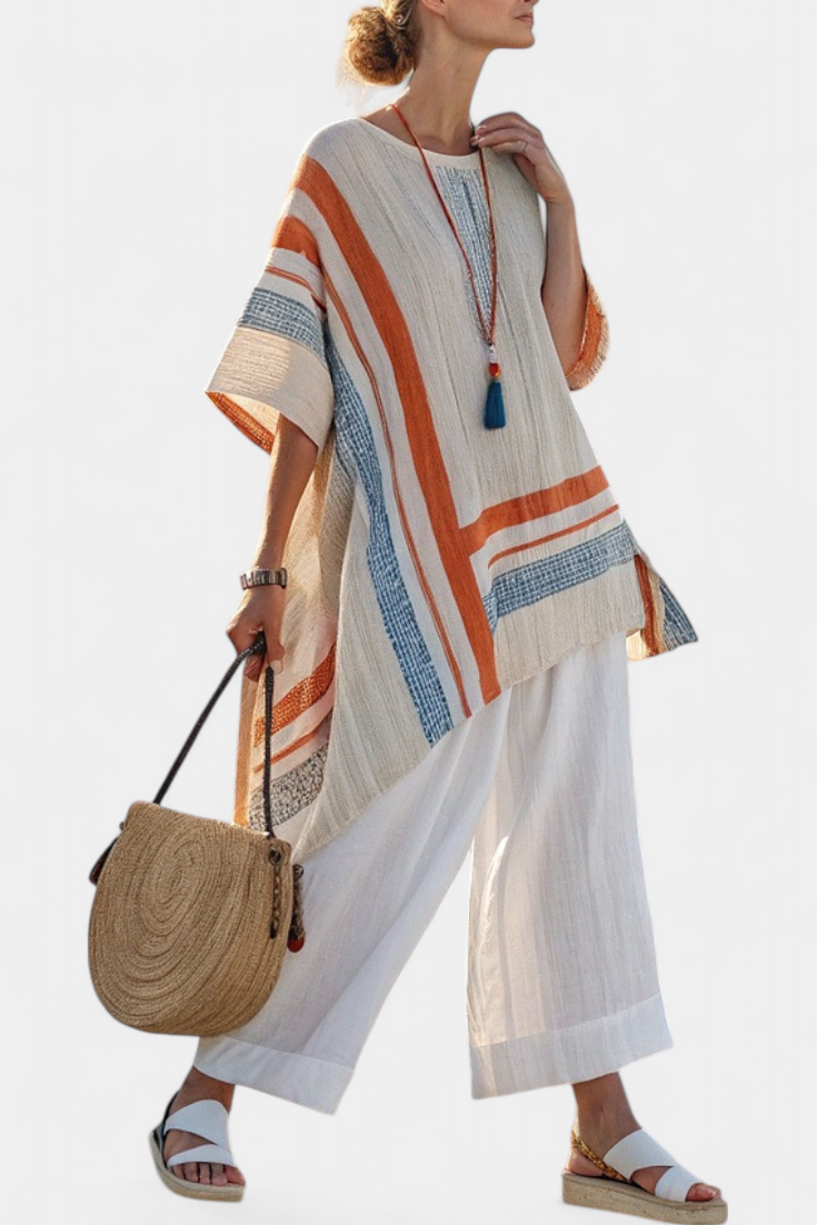 Women's chic asymmetrical blouse and wide-leg pants set. Perfect two-piece summer fashion for vacation.