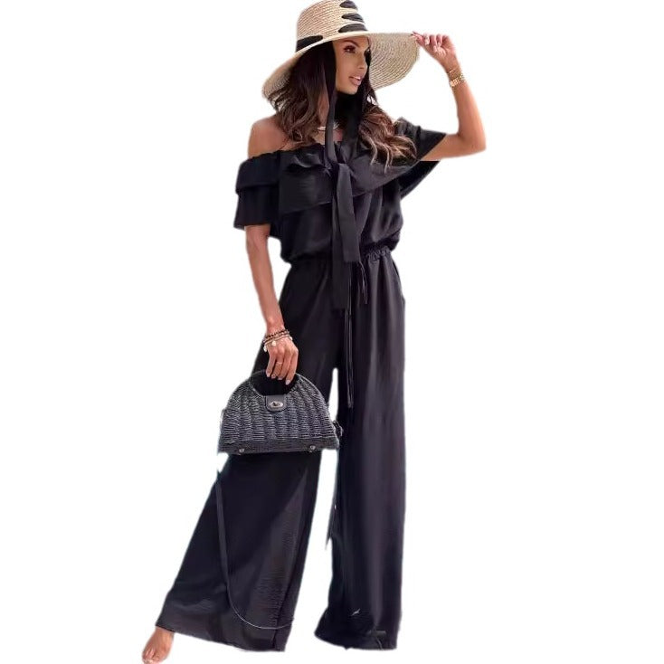 Fashionable women's off-shoulder jumpsuit, featuring a chic design & comfortable wide legs. Elegant women's clothing.