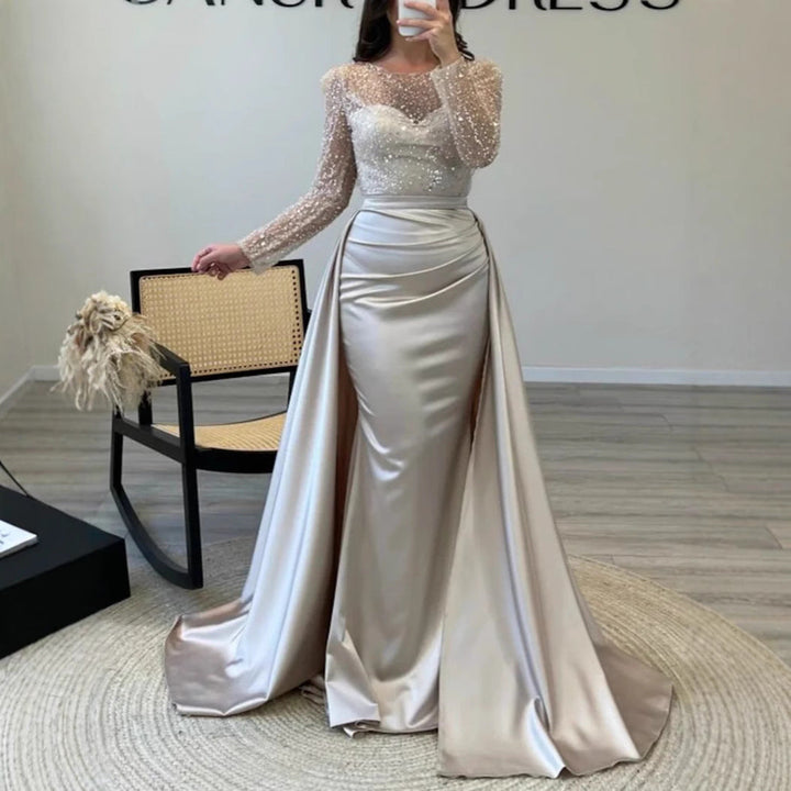 Flattering women's shimmer long-sleeve evening dress. Elegant formal wear for evening parties & galas.