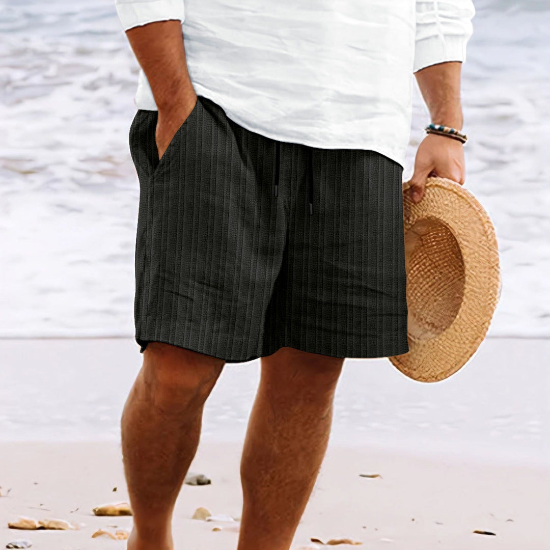 Men's relaxed fit drawstring shorts. Comfortable, casual, and perfect for summer with convenient pockets.