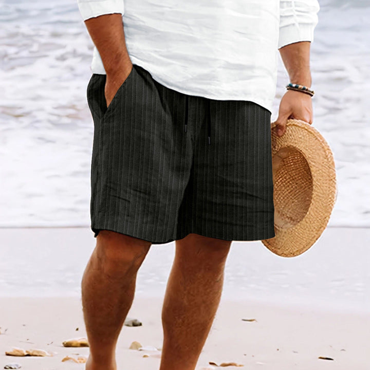 Men's relaxed fit drawstring shorts. Comfortable, casual, and perfect for summer with convenient pockets.