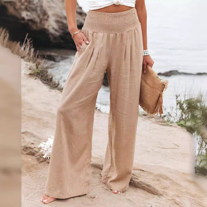 Comfy women's wide leg trousers, elastic waist, relaxed fit, perfect for casual or beachwear.