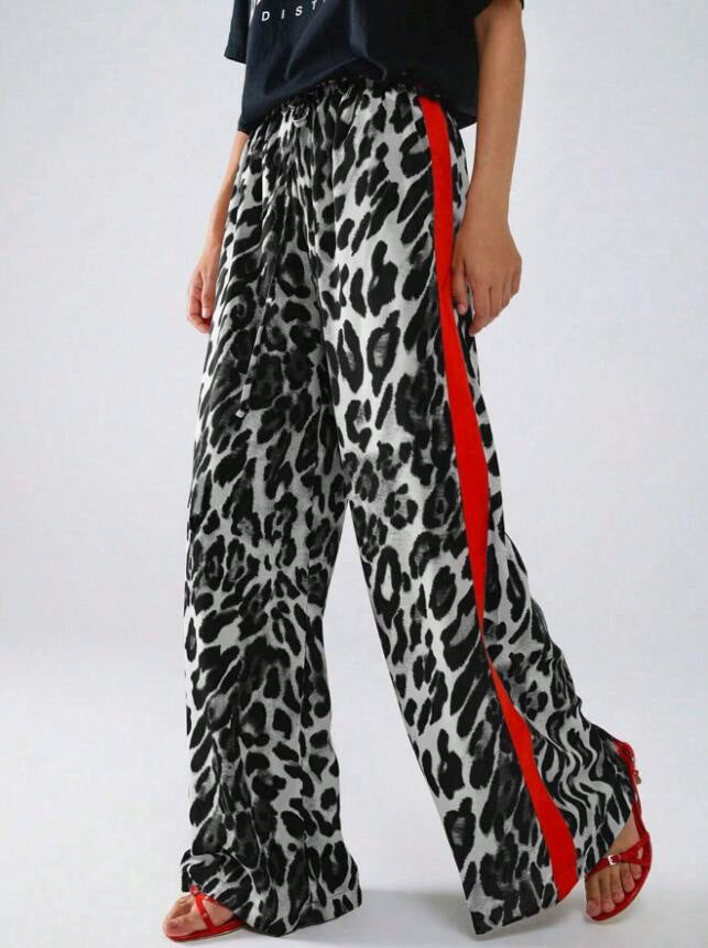 Versatile women's wide-leg leopard print pants with stripe detail. Comfortable & stylish for everyday fashion. Loose fit.