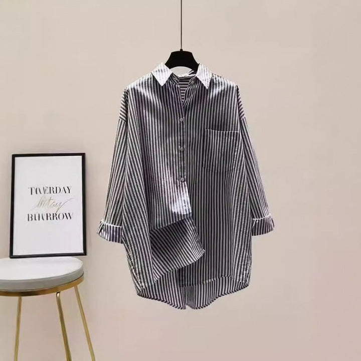 Casual women's striped oversized blouse, featuring a chic high-low hem and practical chest pocket.