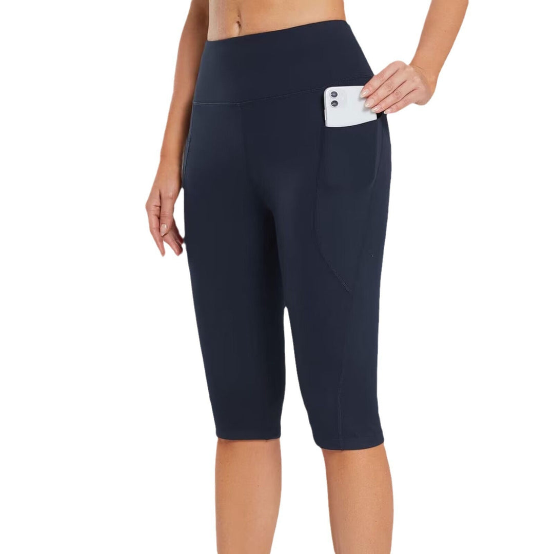 Stylish women's sporty capri pants with side pockets, great for running & active lifestyles.