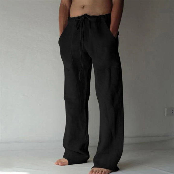 Loose fit men's casual trousers with elastic waist, offering relaxed comfort for daily activities.