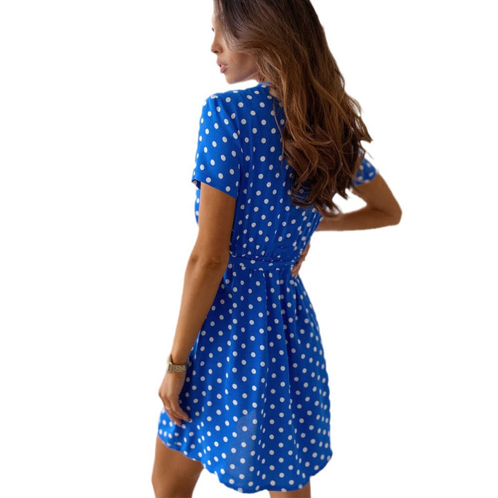 Playful women's polka dot mini wrap dress, a short sleeve V-neck design perfect for summer fun and fashionable daywear.