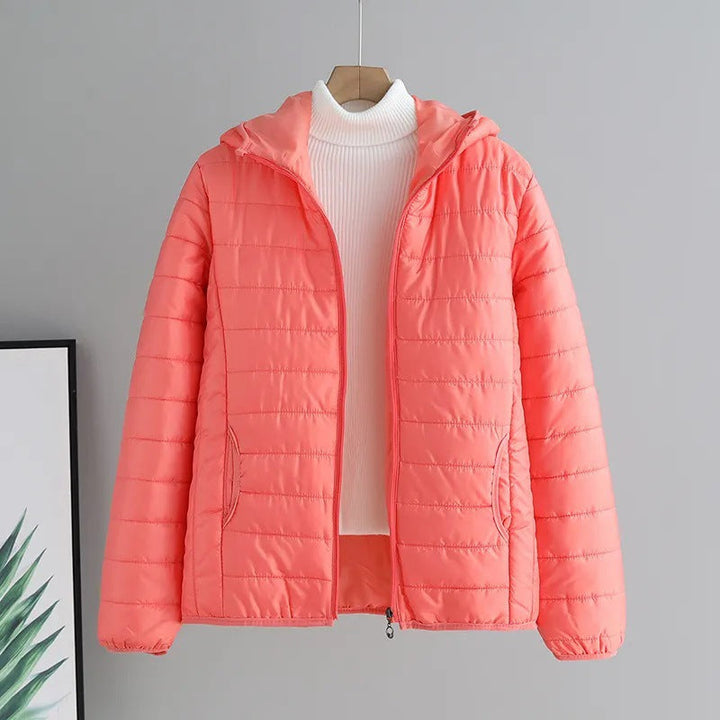 Women's red hooded quilted jacket, a vibrant and cozy option for seasonal outerwear.