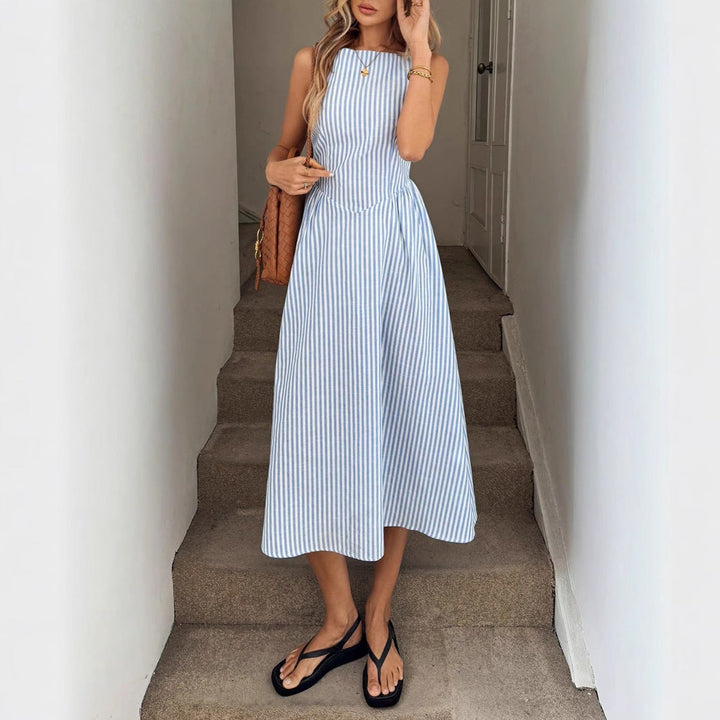 Fitted women's striped midi dress, elegant summer fashion. Versatile round neck design.