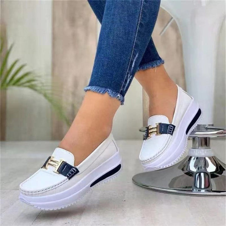 Stylish women's slip-on loafers with a supportive wedge, excellent for all-day comfort and versatility.