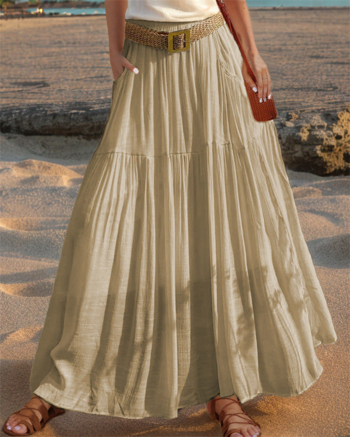 Flowy pleated maxi skirt for women, with pockets, perfect for elegant casual wear.