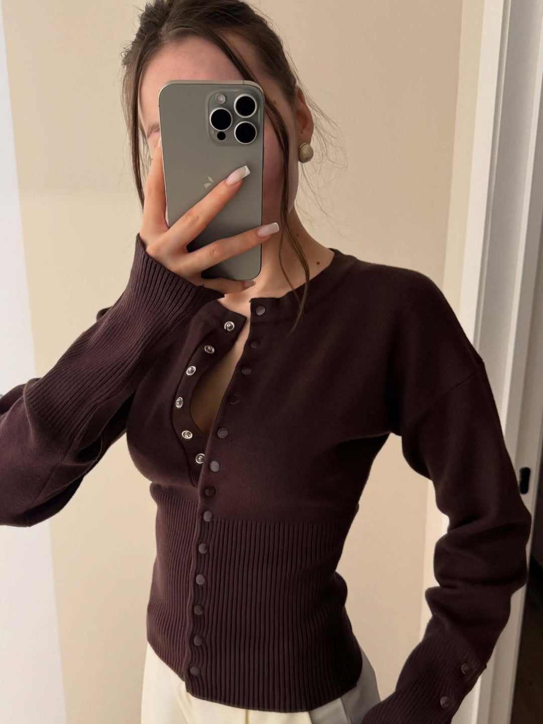 Fashionable women's elegant knit button-up cardigan. A chic layering sweater for casual & transitional style.