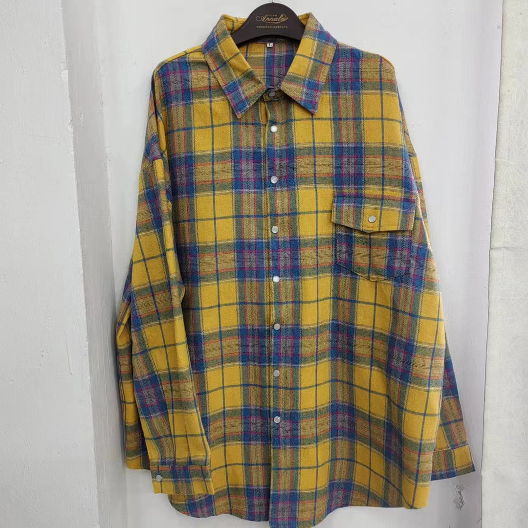Stylish women's oversized plaid button-up shirt, long sleeve, versatile top for effortless chic fashion.