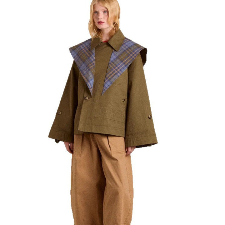 Fashionable women's brown trench coat with practical pockets & a chic distinctive collar, perfect versatile outerwear.