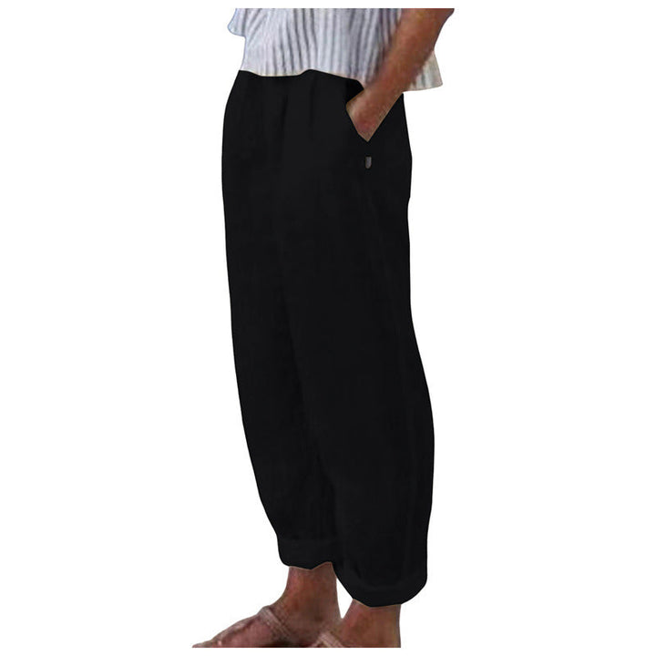 Functional side pockets on women's relaxed fit trousers, combining practicality with stylish, comfortable casual bottoms.
