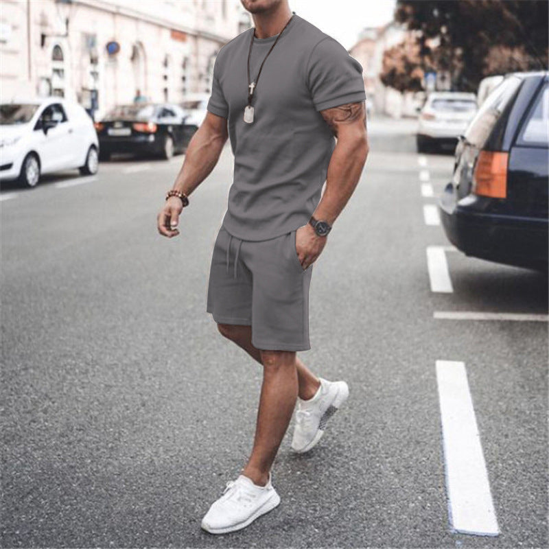Grey men's summer workout outfit, a two-piece breathable tee & shorts set.