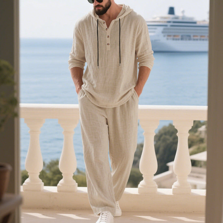 Male model wearing a comfy relaxed fit hoodie set, great for vacation or streetwear.