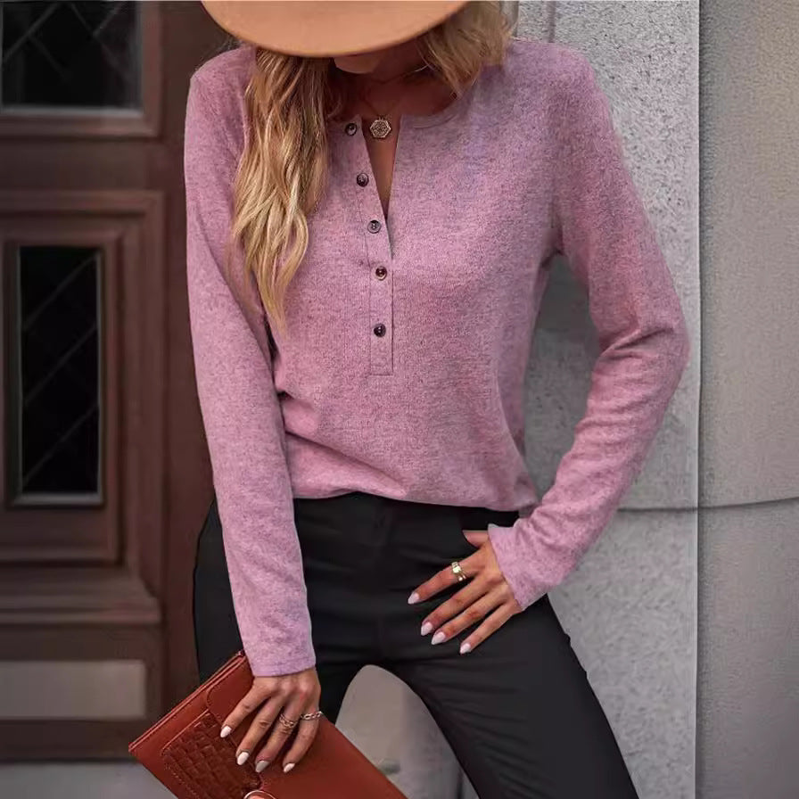 Cozy women's long sleeve top, comfortable and chic, perfect for transitional seasons with button detail.