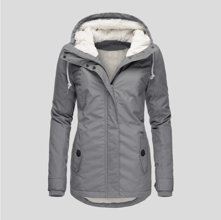 Stylish women's hooded winter coat, shown on model, providing ultimate warmth & cozy comfort for cold weather.