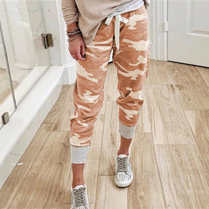 Fashionable women's utility cargo pants, elastic waist, roomy side pockets, versatile casual style.