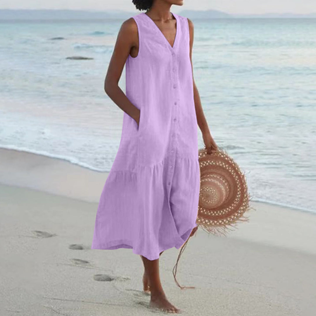 Ladies' stylish sleeveless summer midi dress featuring convenient pockets, ideal for comfortable everyday fashion.