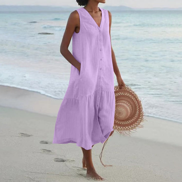 Ladies' stylish sleeveless summer midi dress featuring convenient pockets, ideal for comfortable everyday fashion.