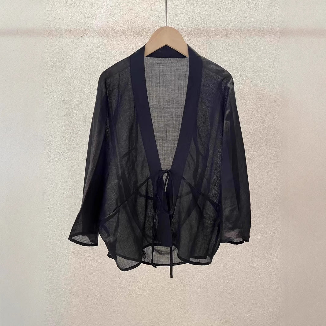 Versatile women's sheer jacket, perfect for a sophisticated summer outfit or elegant beach cover-up.