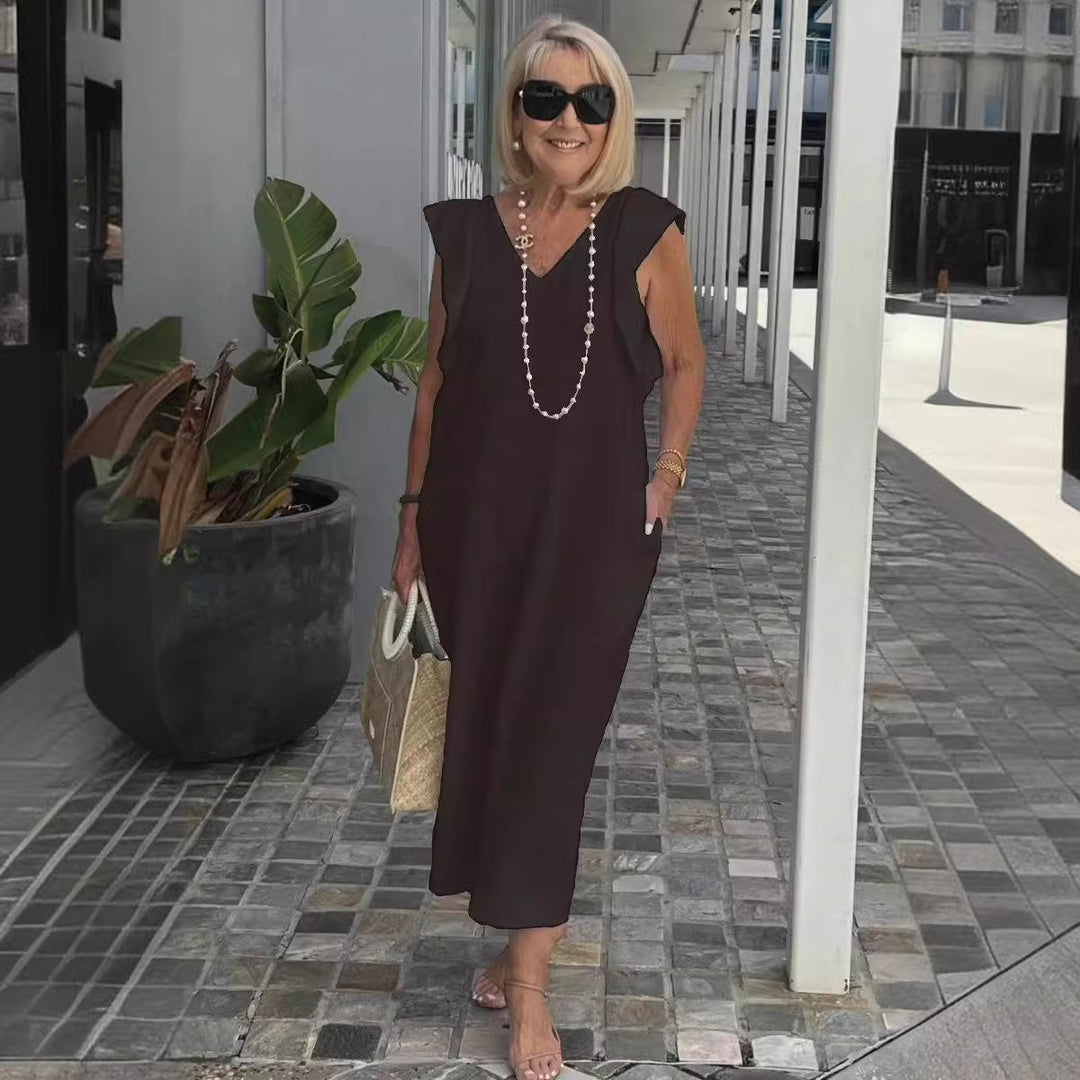 Stylish women's sleeveless summer dress in a flowy maxi design, featuring a comfortable V-neck for vacation.