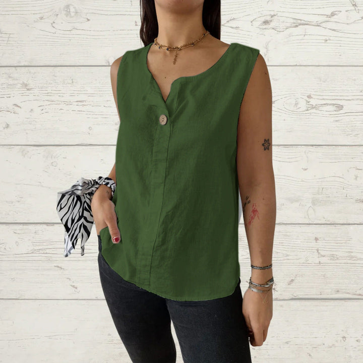 Elegant ladies sleeveless blouse with button accents. Ideal for versatile summer fashion & warm weather.