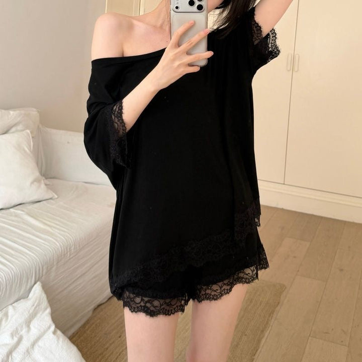 Comfortable black women's home wear set: boat neck top & drawstring shorts with subtle lace accents.