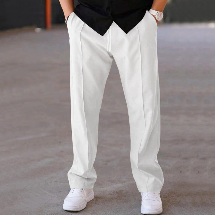 Folded grey men's joggers, showing compact design for easy storage & travel, ultimate comfort.