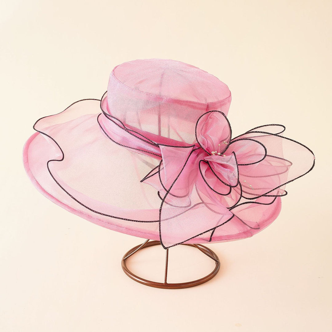 Delicate mesh sun hat for women, featuring an elegant design and a charming romantic bow.